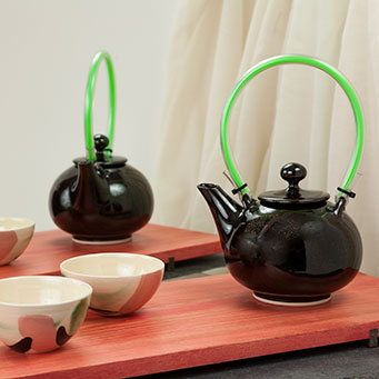 Stoneware teapot with tenmoku glaze and green acrylic handle – French private collection